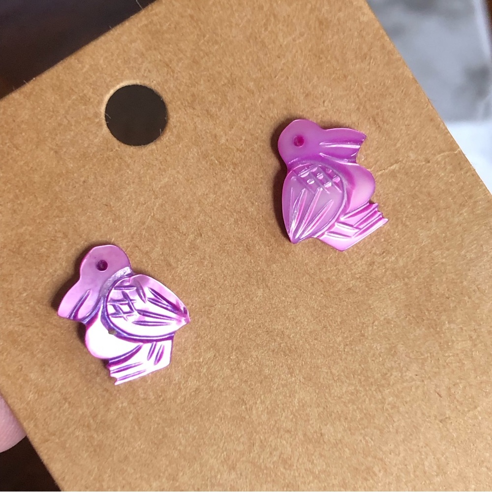 Handmade violet carved shell pelican pierced earrings